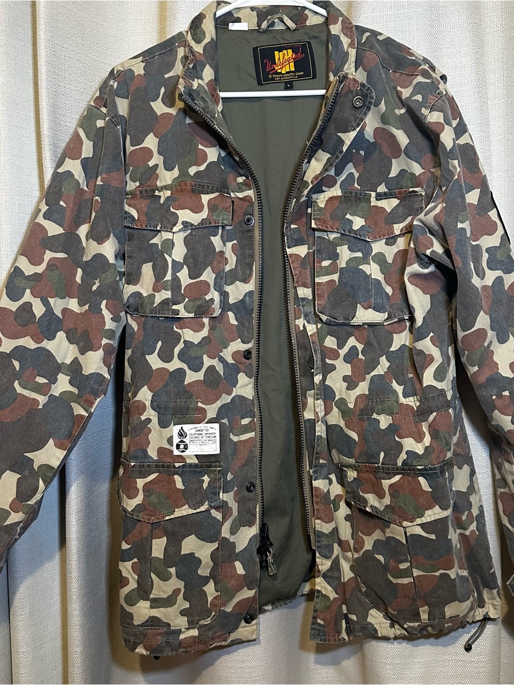 UNDEFEATED “Play Dirty” camo utility/military-style jacket, size L